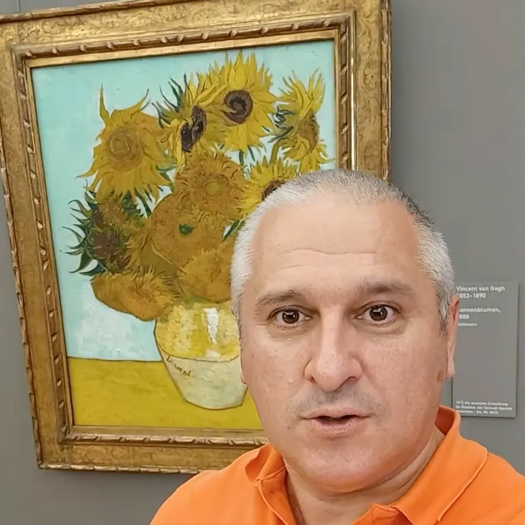 Sergey Raevsky next to Van Gogh's Sunflowers